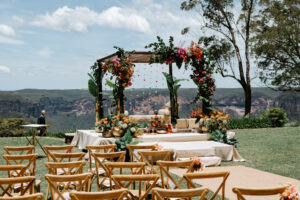 Indian wedding mandap overlooking the Blue Mountains, blending traditional Indian décor with elegant Western wedding styling